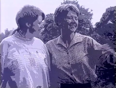 Video still. Posterised image of two women.