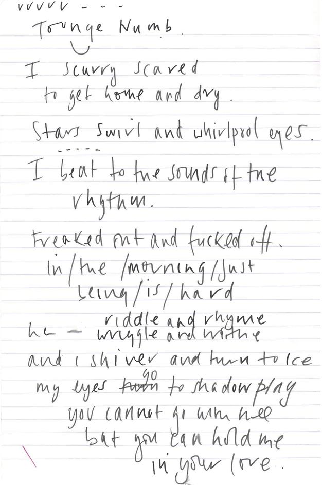 Colour photograph. White notepaper with pale red printed lines and handwritten notes in black ink across the page. Writing slopes slightly towards the right and covers most of the page, a diagonal red ink line echoes the flow of writing in the lower-left corner.